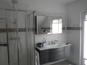 a bathroom with a sink and a shower at Haus Rading in Rading +28 photos