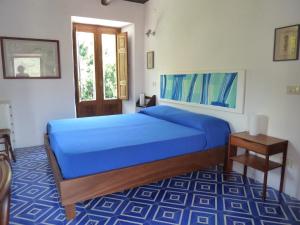 Postel nebo postele na pokoji v ubytování Casa Puccini B&B Maratea