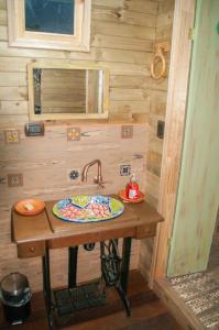 a bathroom with a sink in a tiny house at xuetama in Villa de Leyva