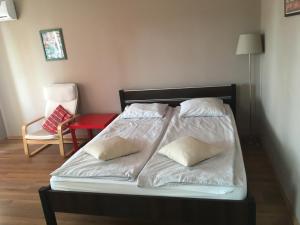 Łóżko lub łóżka w pokoju w obiekcie Apartament Wrzos