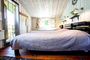 מיטה או מיטות בחדר ב-Mi Sann Holiday Home