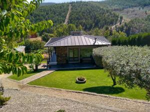 an aerial view of a small house with a garden at Canastro Country House in Castelo de Paiva