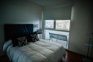 A bed or beds in a room at Ribera de Pipo Cálido departamento para tu estancia