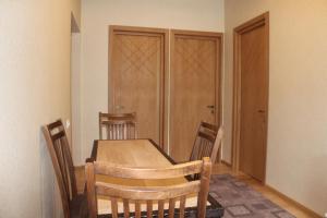 a dining room with a wooden table and chairs at Rustaveli st11 in Stepantsminda +22 photos