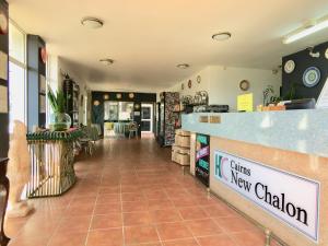 a restaurant lobby with a counter and a dining new salon at South Cairns Resort in Cairns