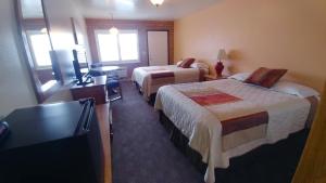 Postel nebo postele na pokoji v ubytování Blue Pine Motel