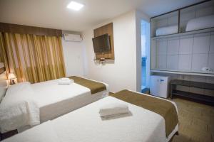 Postel nebo postele na pokoji v ubytování Hotel Vivere Cataratas