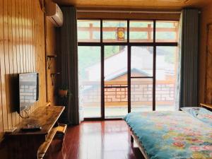 Postelja oz. postelje v sobi nastanitve Tongfu Inn(In the National Park)