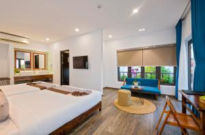 Postel nebo postele na pokoji v ubytování December Hoi An Villa