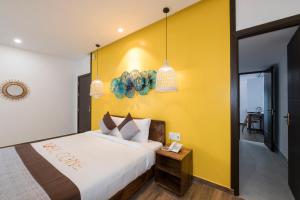 Postel nebo postele na pokoji v ubytování December Hoi An Villa