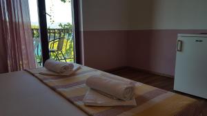 Postel nebo postele na pokoji v ubytování Apartments and Room Caric