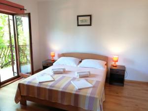 Postel nebo postele na pokoji v ubytování Apartments and Room Caric