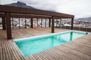 a swimming pool on the roof of a building at Harbour Views B101 in Cape Town