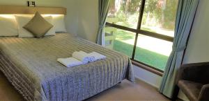 Tempat tidur dalam kamar di Broken River Mountain Resort