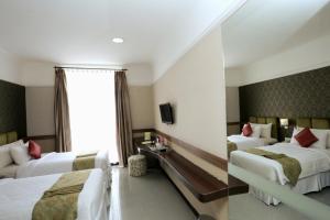 Postel nebo postele na pokoji v ubytování Amarelo Hotel Solo