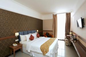 Postel nebo postele na pokoji v ubytování Amarelo Hotel Solo + 36 fotografií