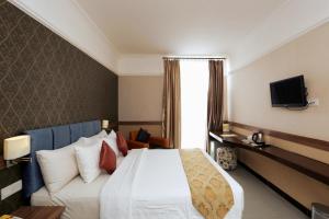 Postel nebo postele na pokoji v ubytování Amarelo Hotel Solo