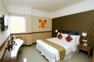 Postel nebo postele na pokoji v ubytování Amarelo Hotel Solo