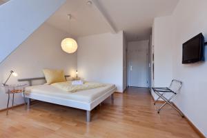 Postel nebo postele na pokoji v ubytování Pensionsieben Das andere Hotel