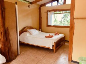 Cama o camas de una habitación en Cabañas Moenga
