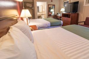 Voodi või voodid majutusasutuse Port Augusta Inn toas