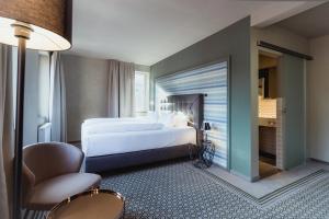 Postel nebo postele na pokoji v ubytování Hotel Goldene Traube - by Neugart