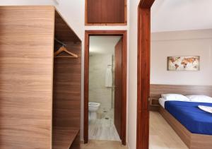 Postel nebo postele na pokoji v ubytování Alexandros SeaView Suites