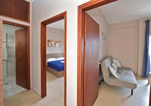 Postel nebo postele na pokoji v ubytování Alexandros SeaView Suites