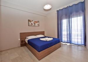 Postel nebo postele na pokoji v ubytování Alexandros SeaView Suites