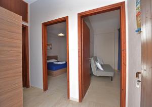 Postel nebo postele na pokoji v ubytování Alexandros SeaView Suites