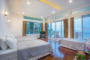 Postel nebo postele na pokoji v ubytování Aranava Resort Huahin