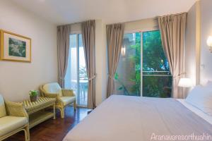 Postel nebo postele na pokoji v ubytování Aranava Resort Huahin