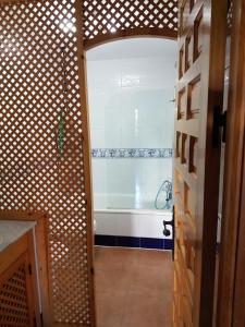 a bathroom with a shower and a bath tub at Apartamentos Atlanterra COSTA Y SOL in Zahara de los Atunes
