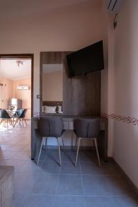 TV a/nebo společenská místnost v ubytování Cyrenia Guesthouse