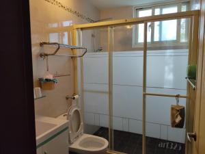 Koupelna v ubytování Yi Tian Homestay