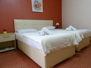 Postel nebo postele na pokoji v ubytování Signature Idea hotel