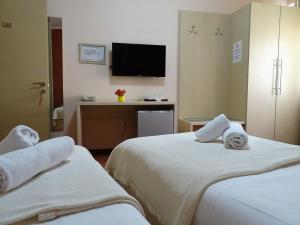Postel nebo postele na pokoji v ubytování Signature Idea hotel