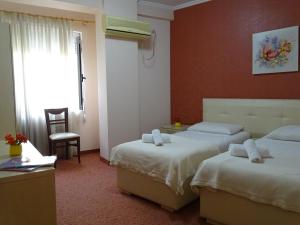 Postel nebo postele na pokoji v ubytování Signature Idea hotel