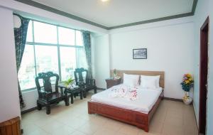 Postel nebo postele na pokoji v ubytování H79 HOTEL