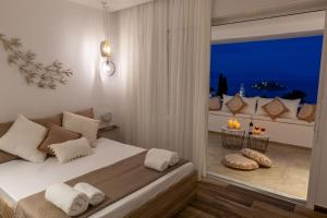 Katil atau katil-katil dalam bilik di Elena's Tolo sea view