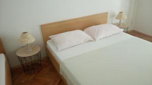 Postel nebo postele na pokoji v ubytování Apartments Gaston