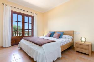 A bed or beds in a room at Es Vedat 6