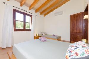 A bed or beds in a room at Es Vedat 6