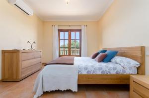 A bed or beds in a room at Es Vedat 6