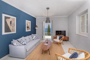 a living room with a couch and a table at St Jakov Superior Beach Apartment with Free Parking in Dubrovnik