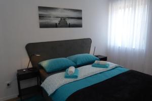 Postel nebo postele na pokoji v ubytování Prestige West Residence