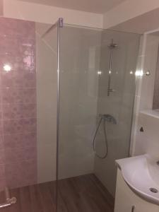 a shower with a glass door in a bathroom at Villa Maria in Šilo +21 photos