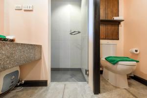 a bathroom with a toilet and a shower at Krabi Chada Resort - SHA Plus in Ao Nang Beach