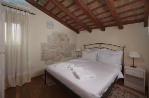 Кровать или кровати в номере Angelo d'Oro Apartments Trevisol