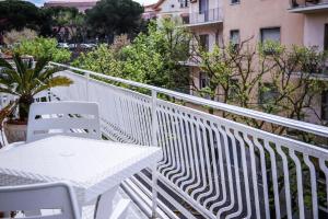 a white table and chairs on a balcony at MarioHome in Sassari